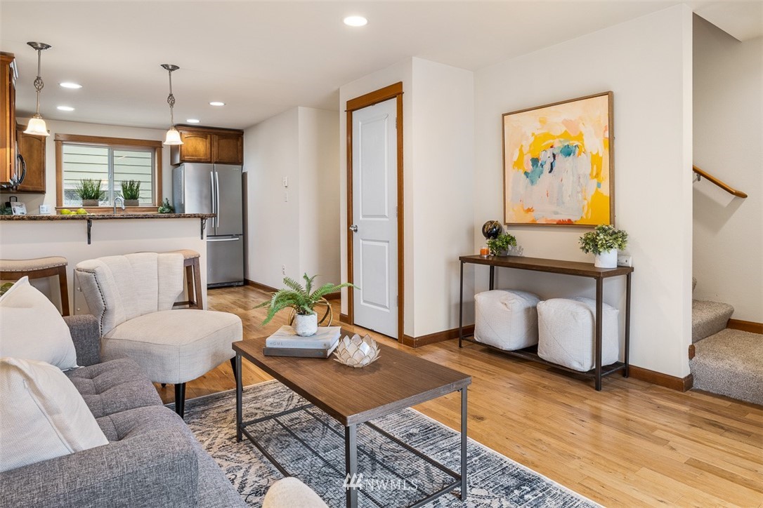 1122 North 92nd Street, Unit B Seattle, WA 98103 - Photo 20 of 32 a living room with furniture and wooden floor