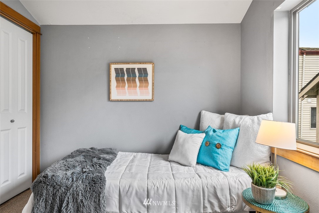 1122 North 92nd Street, Unit B Seattle, WA 98103 - Photo 21 of 32 a bedroom with a bed and a window