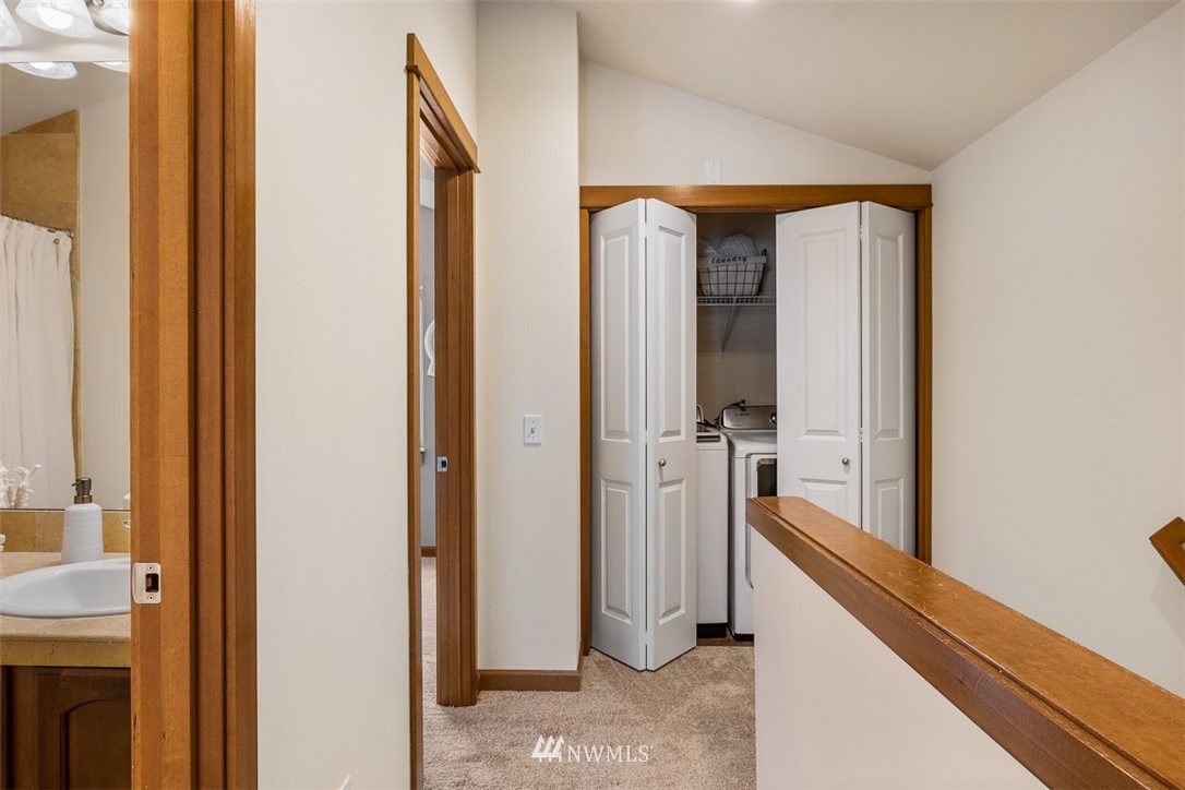 1122 North 92nd Street, Unit B Seattle, WA 98103 - Photo 22 of 32 a view of a bathroom from a hallway