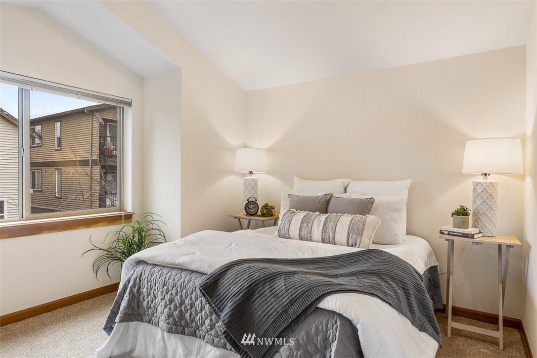 1122 North 92nd Street, Unit B Seattle, WA 98103 - Photo 25 of 32 a bedroom with double bed and a window