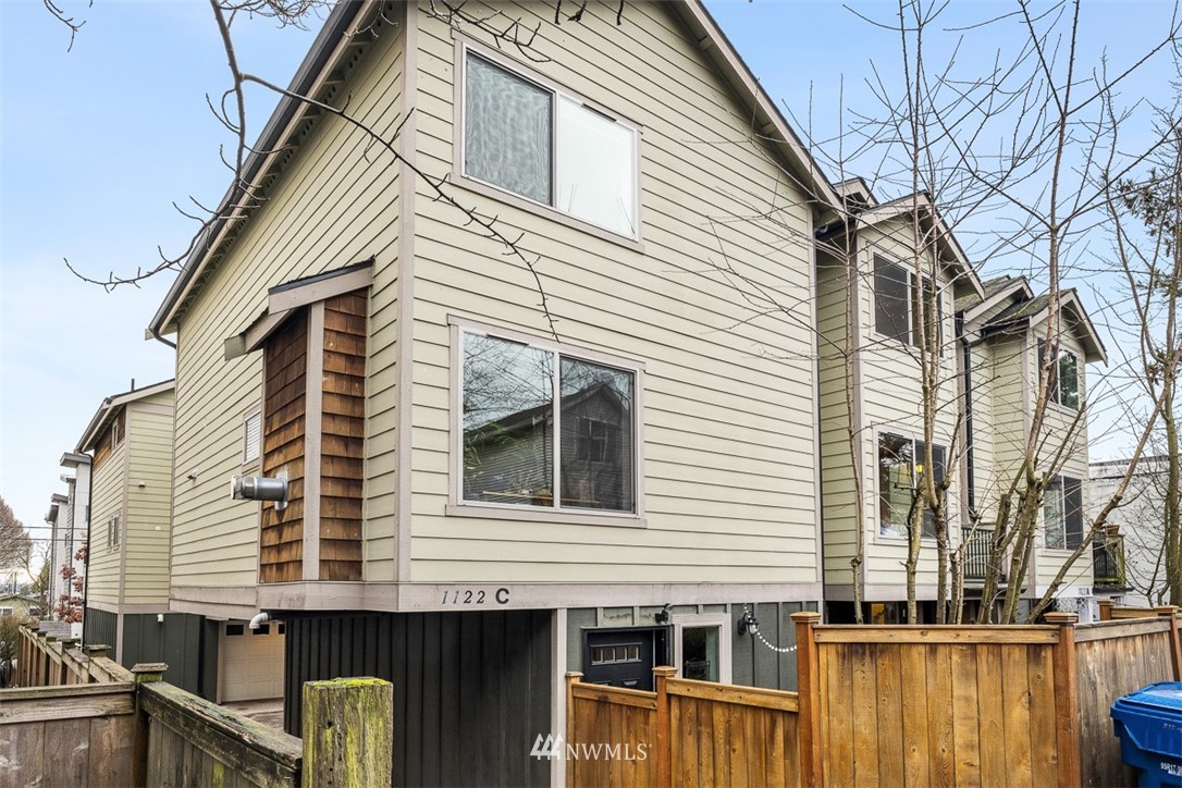 1122 North 92nd Street, Unit B Seattle, WA 98103 - Photo 3 of 32 a view of a house with a balcony
