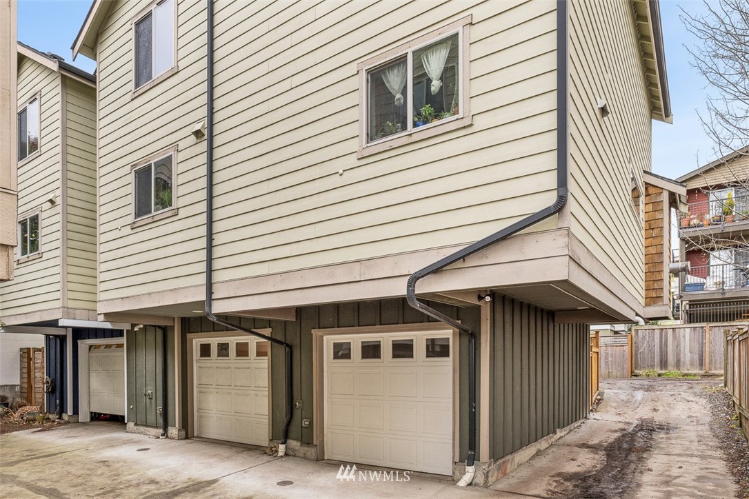 1122 North 92nd Street, Unit B Seattle, WA 98103 - Photo 31 of 32 a front view of a house with parking