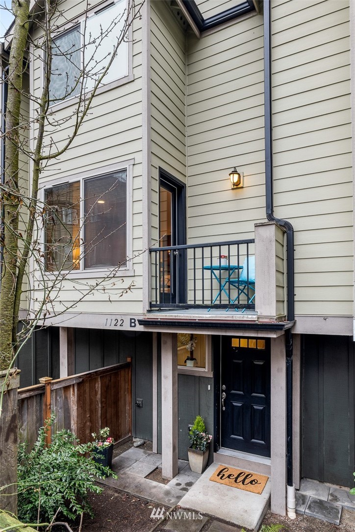 1122 North 92nd Street, Unit B Seattle, WA 98103 - Photo 4 of 32 a building with glass windows