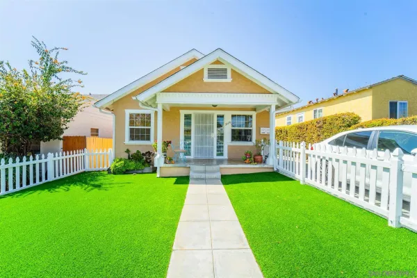 a front view of a house with yard