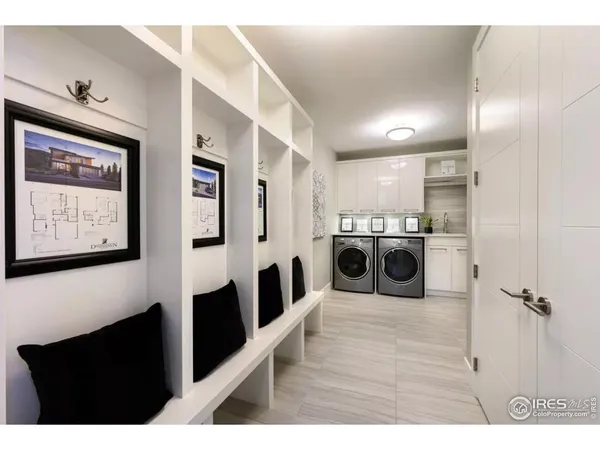 a spacious bathroom with a tub sink and mirror