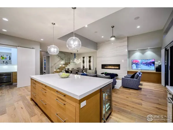 a dining room with furniture and wooden floor