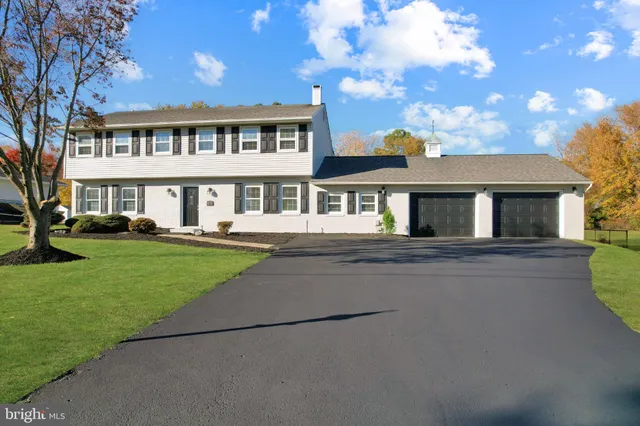 an aerial view of a house with outdoor space pool seating area and yard