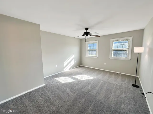 a bathroom with a double vanity sink and mirror