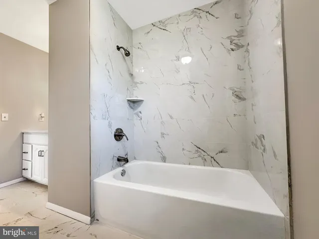 a view of a ocean with a table and chairs in patio