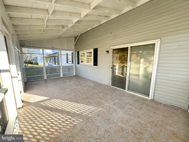 a view of a swimming pool and lounge chair