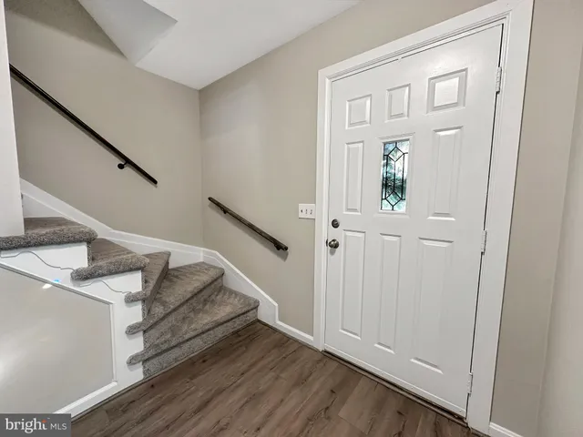 a kitchen with stainless steel appliances a refrigerator sink and microwave