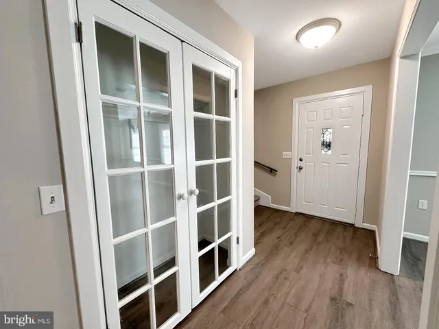 a large kitchen with a stove top oven and sink