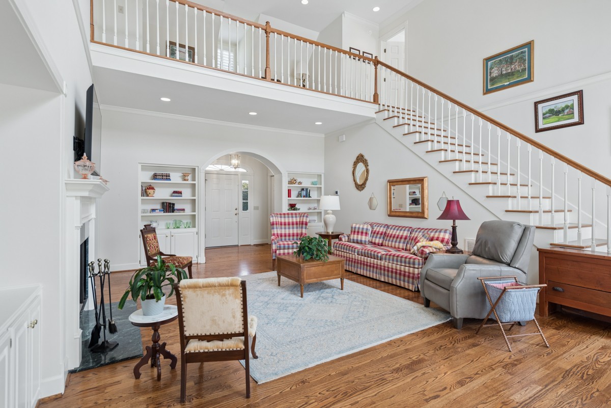 255 Lindsey Hollow Road Gallatin, TN 37066 - Photo 13 of 40 a living room with furniture or stairs and a wooden floor