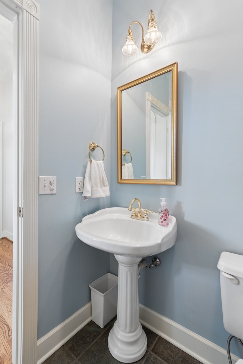 255 Lindsey Hollow Road Gallatin, TN 37066 - Photo 20 of 40 a bathroom with a toilet a sink and mirror