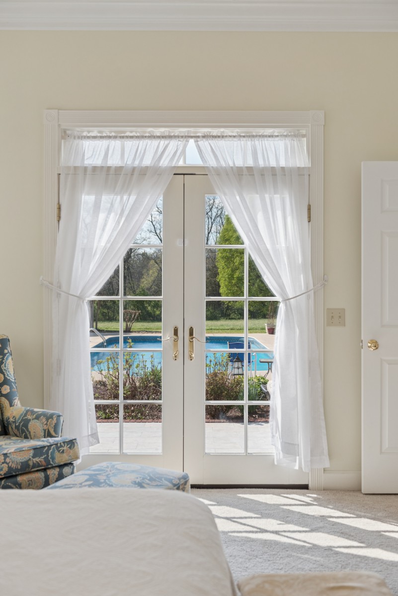 255 Lindsey Hollow Road Gallatin, TN 37066 - Photo 22 of 40 a view of a room that has a large window and a wooden table