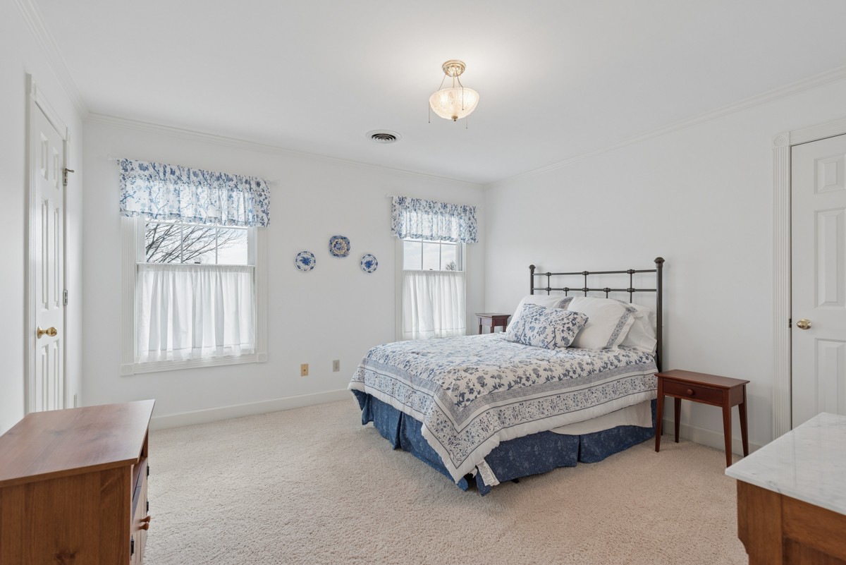 255 Lindsey Hollow Road Gallatin, TN 37066 - Photo 25 of 40 a spacious bedroom with a bed and a window