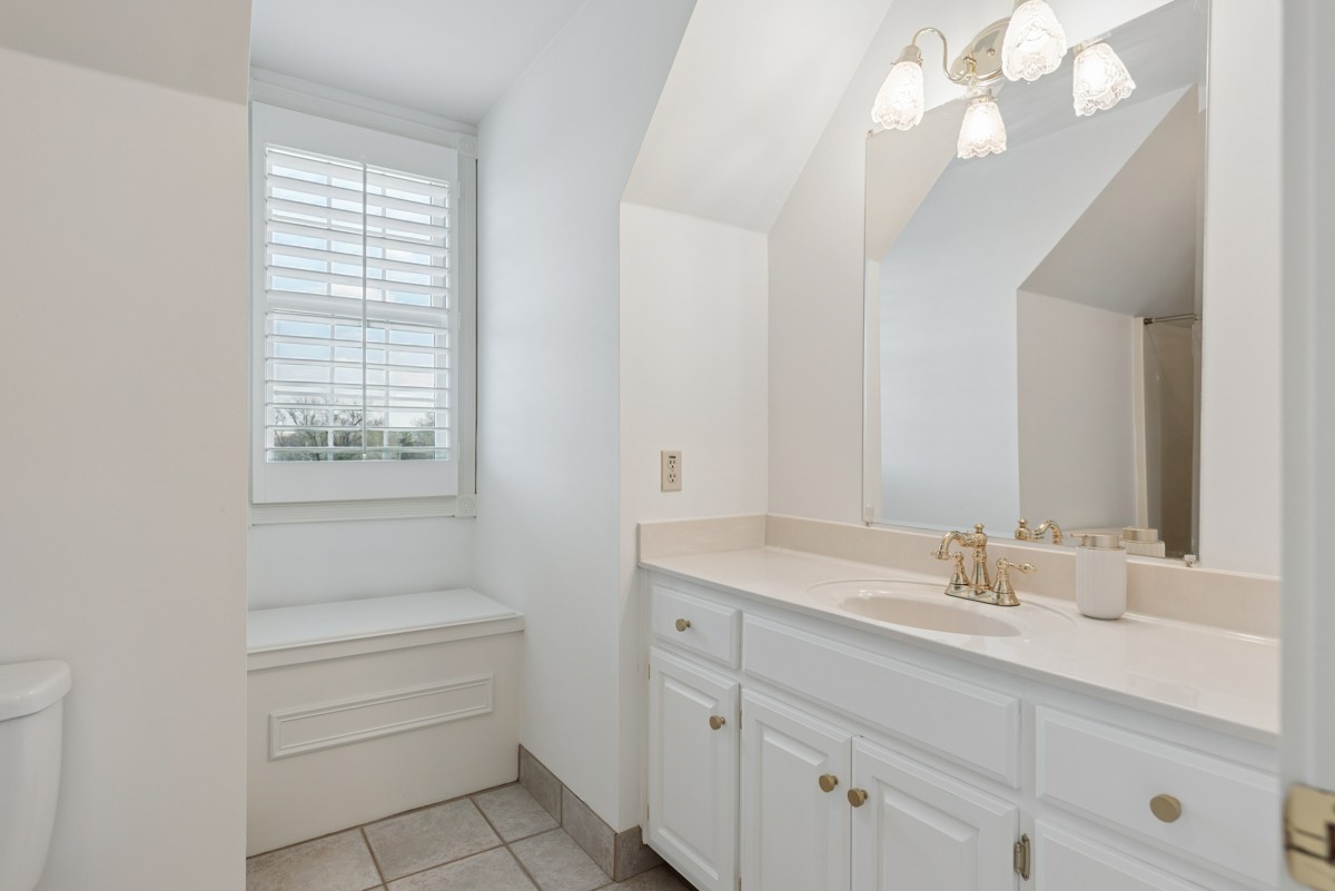 255 Lindsey Hollow Road Gallatin, TN 37066 - Photo 26 of 40 a bathroom with a sink a vanity and a mirror