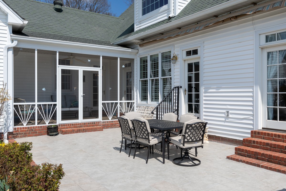 255 Lindsey Hollow Road Gallatin, TN 37066 - Photo 34 of 40 a view of a dinning table and chairs in the porch