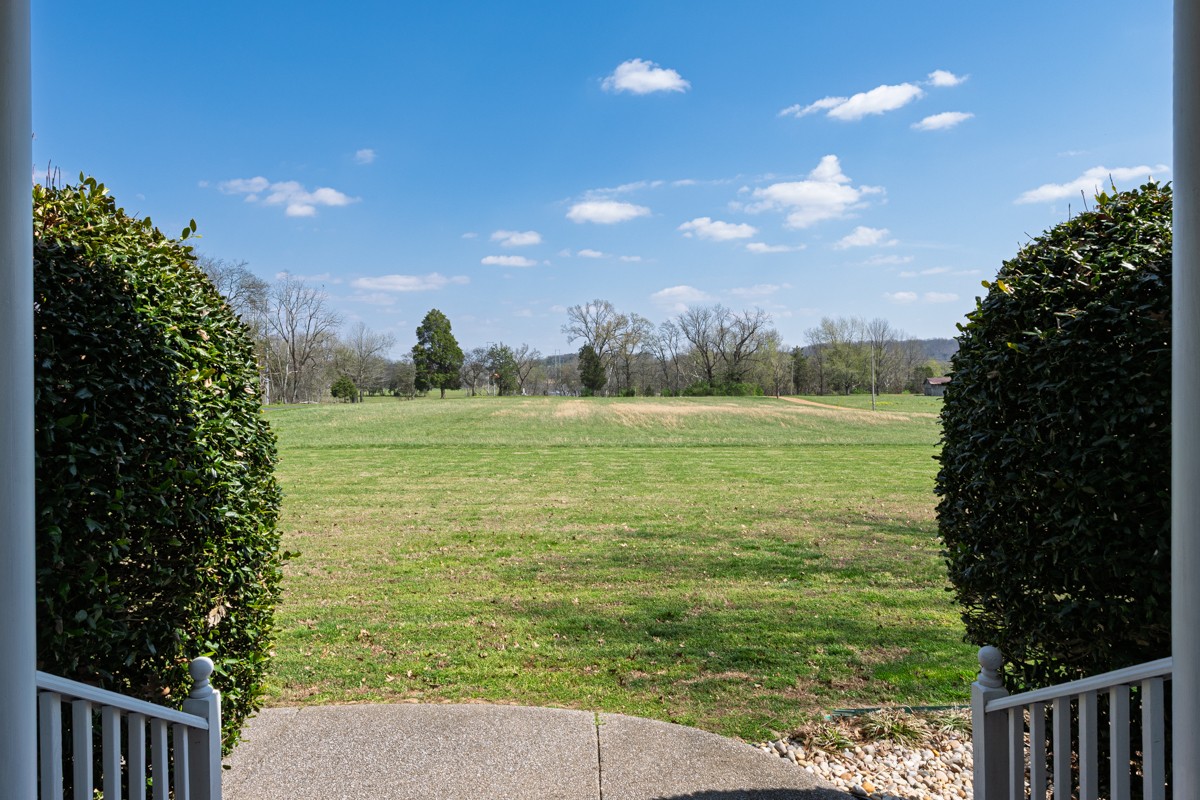255 Lindsey Hollow Road Gallatin, TN 37066 - Photo 6 of 40 a view of a field with an trees in the background