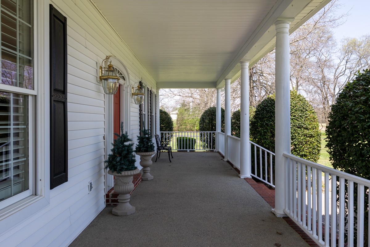 255 Lindsey Hollow Road Gallatin, TN 37066 - Photo 7 of 40 a view of a porch with chairs in front of house