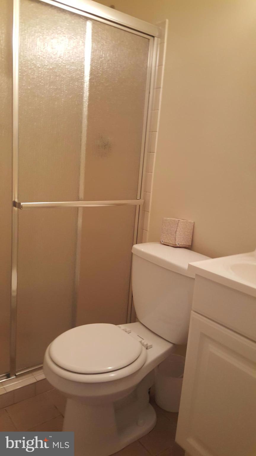 331 Londontown Road Edgewater, MD 21037 - Photo 17 of 23 a white toilet sitting next to a shower