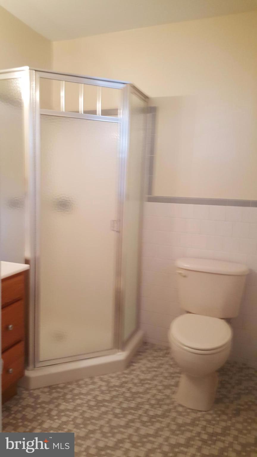 331 Londontown Road Edgewater, MD 21037 - Photo 20 of 23 a bathroom with a toilet and a shower