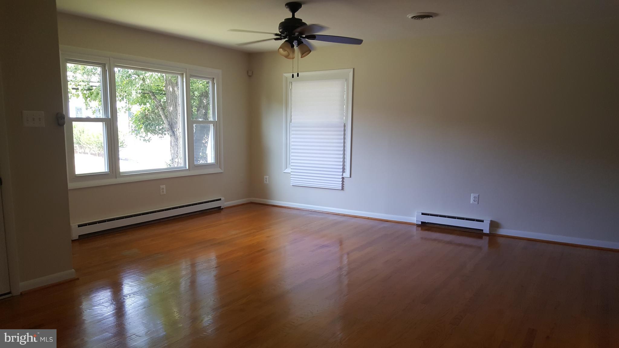 331 Londontown Road Edgewater, MD 21037 - Photo 3 of 23 an empty room with wooden floor and windows