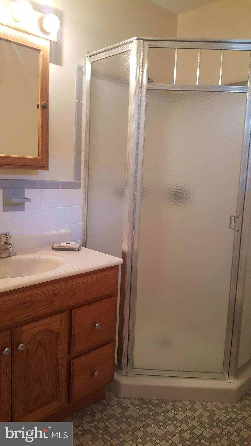 331 Londontown Road Edgewater, MD 21037 - Photo 21 of 23 a bathroom with a sink and mirror