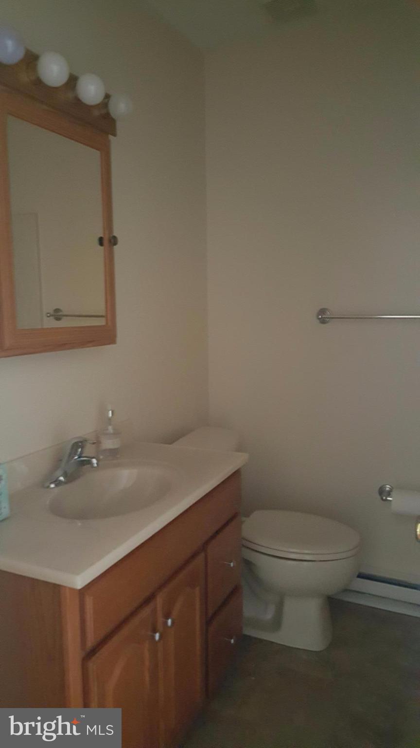 331 Londontown Road Edgewater, MD 21037 - Photo 23 of 23 a bathroom with a sink toilet and vanity