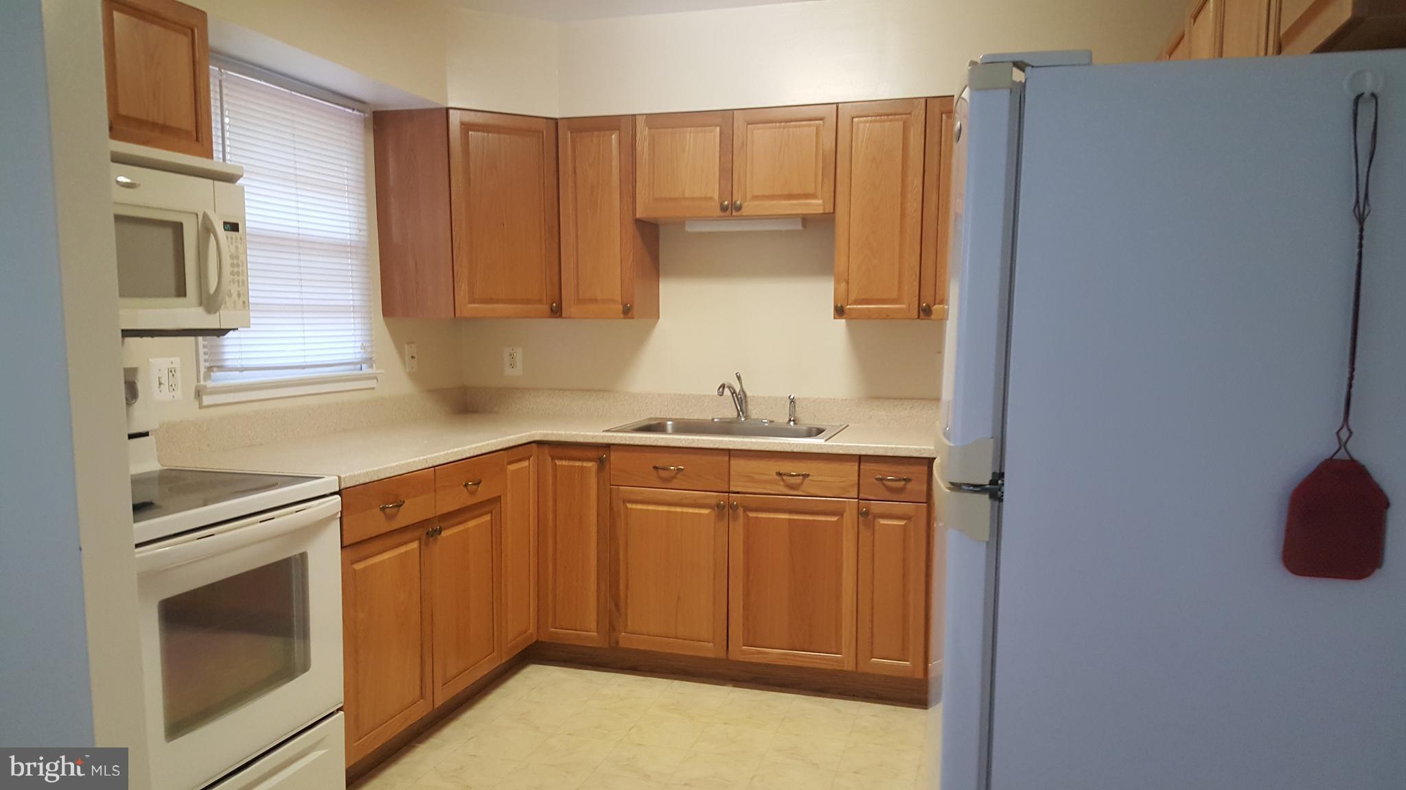 331 Londontown Road Edgewater, MD 21037 - Photo 6 of 23 a kitchen with stainless steel appliances granite countertop a refrigerator and a sink