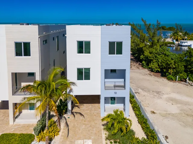 a view of front of house with potted plants