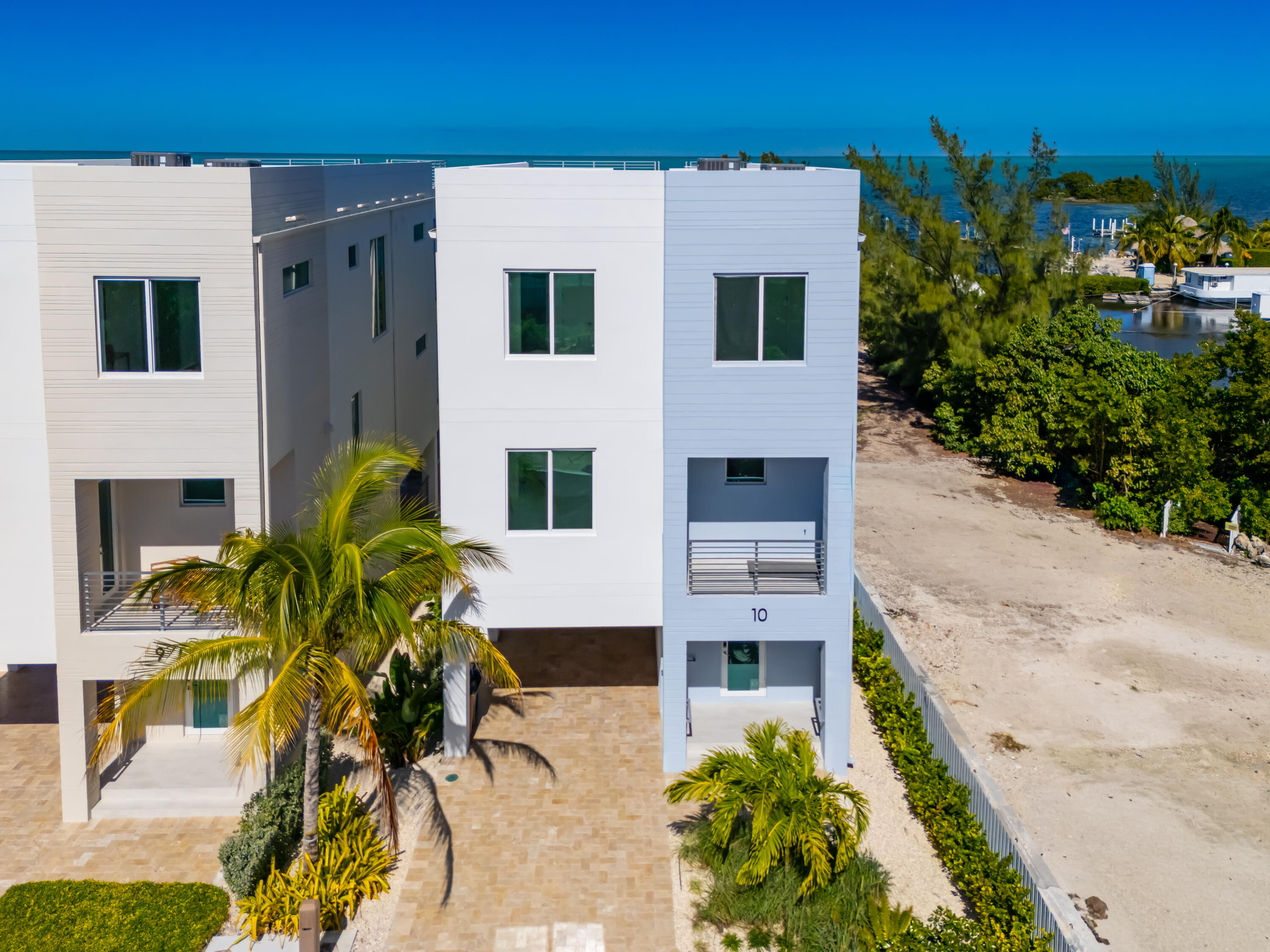 990 41st Street, Unit 10 Marathon, FL 33050 - Photo 2 of 55 a view of front of house with potted plants