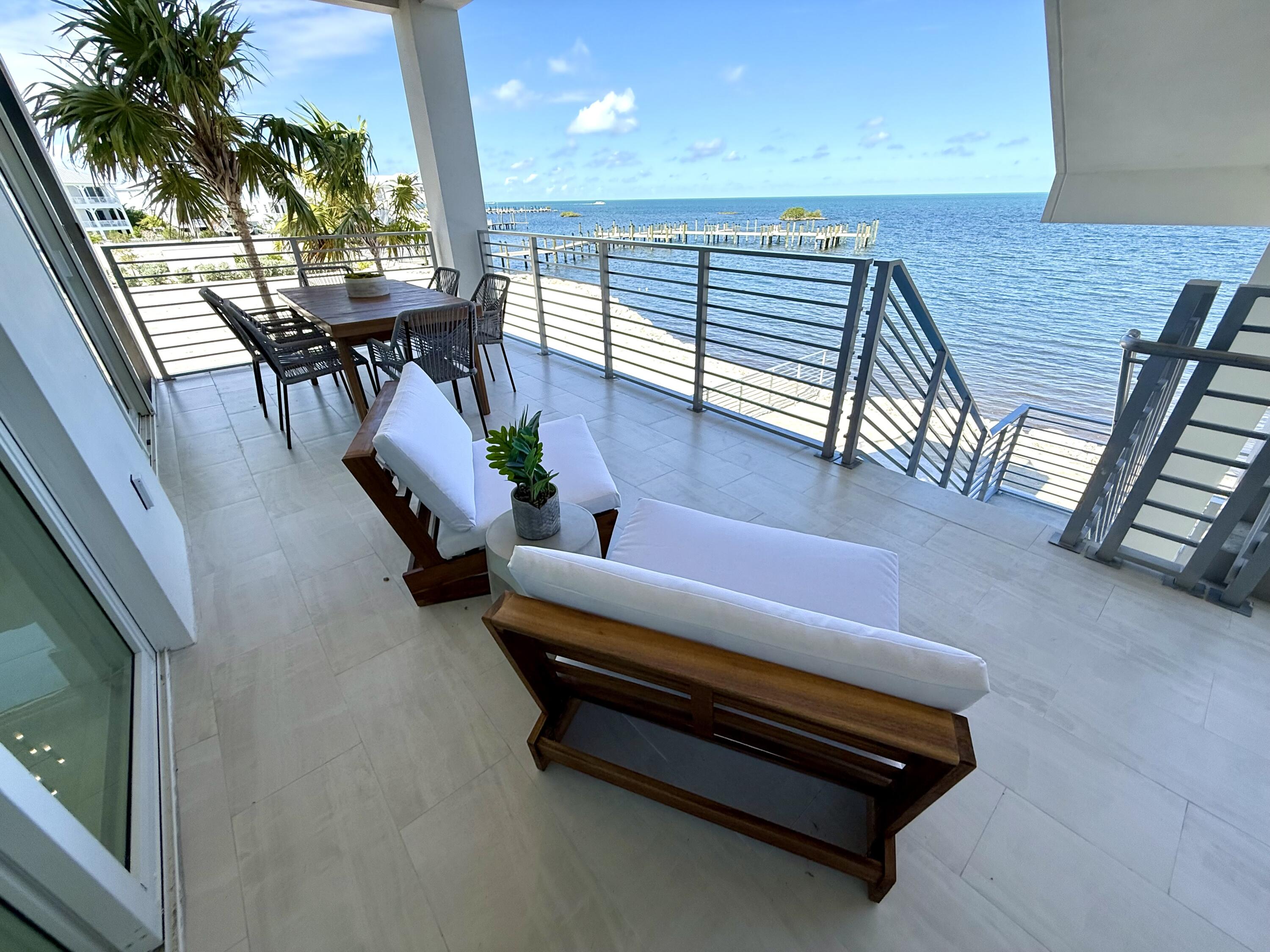 990 41st Street, Unit 10 Marathon, FL 33050 - Photo 22 of 55 an outdoor living room with furniture and a potted plant