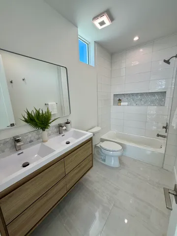 a bedroom with a bed and a mirror