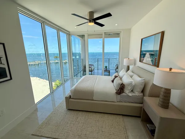 a bedroom with a bed and a couch