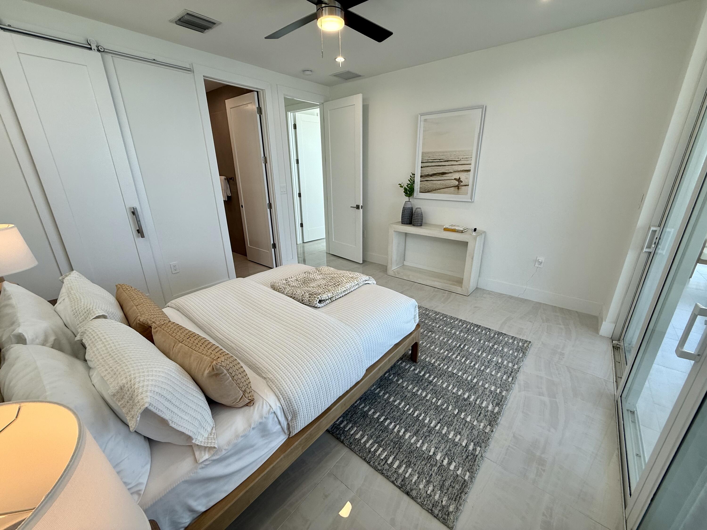 990 41st Street, Unit 10 Marathon, FL 33050 - Photo 35 of 55 a bedroom with a bed and a couch