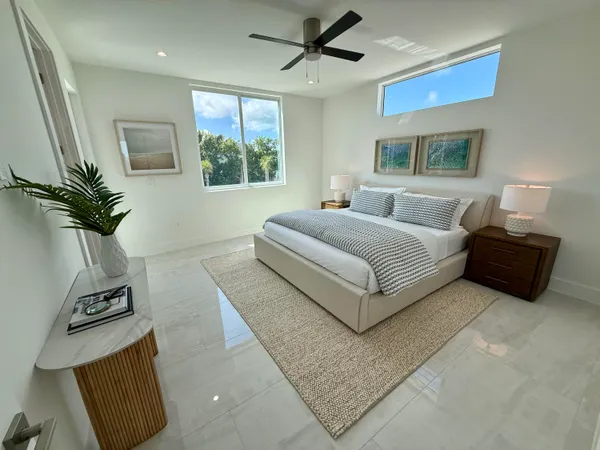 a bedroom with a large bed and a couch