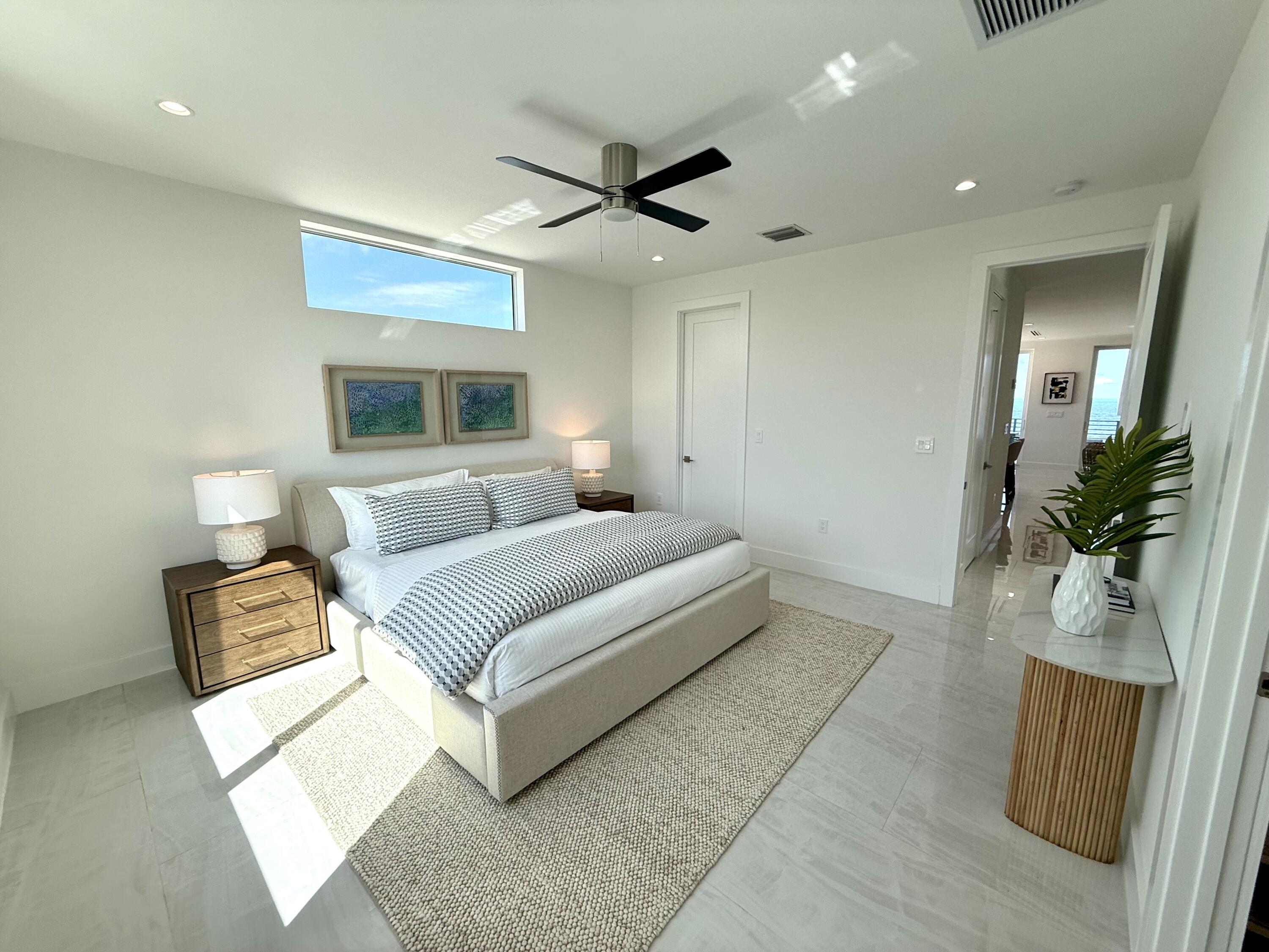 990 41st Street, Unit 10 Marathon, FL 33050 - Photo 10 of 55 a bedroom with a large bed and a couch