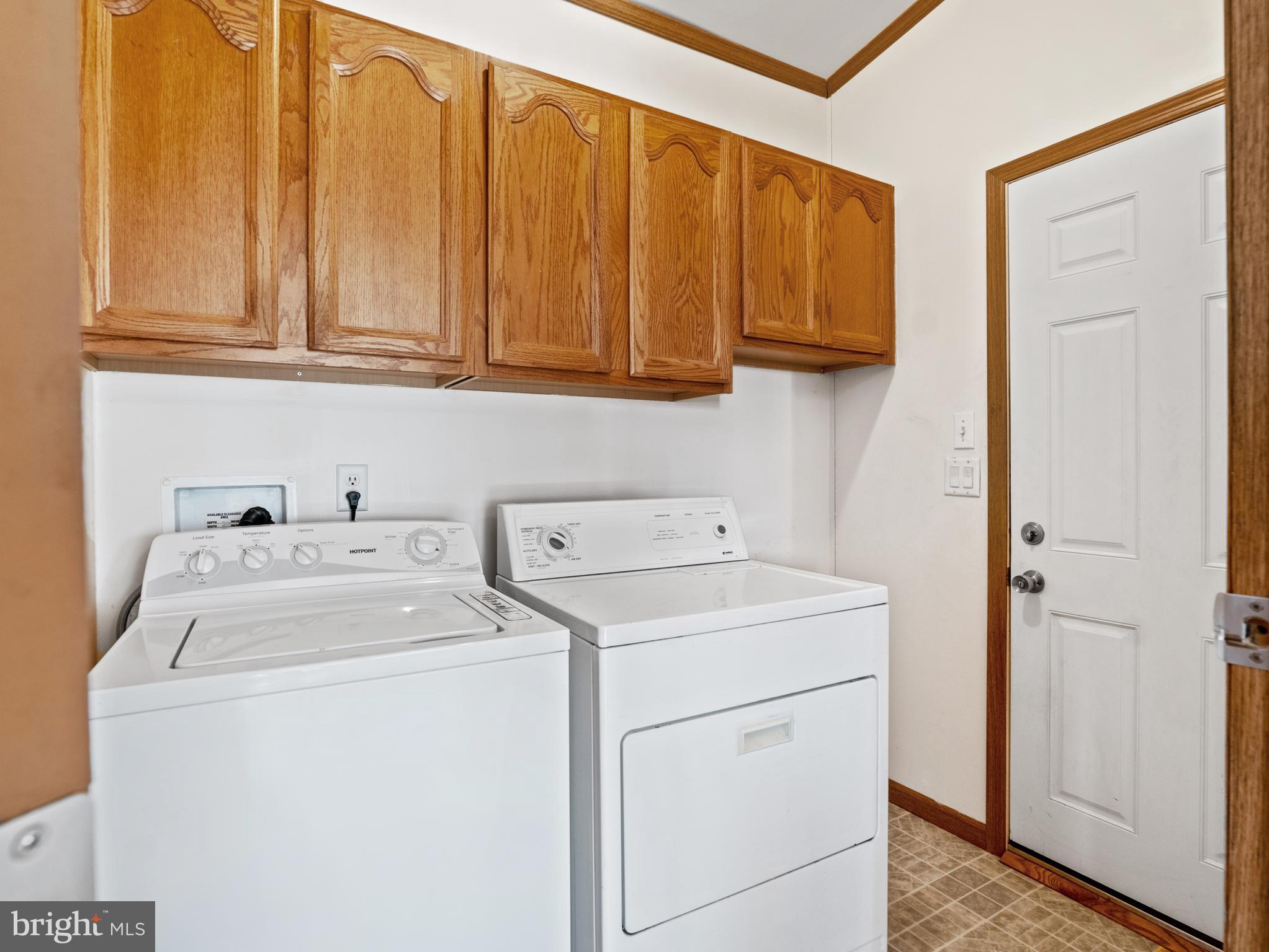 610 Audrey Drive, Unit 610 Dover, DE 19901 - Photo 14 of 27 a utility room with dryer and washer