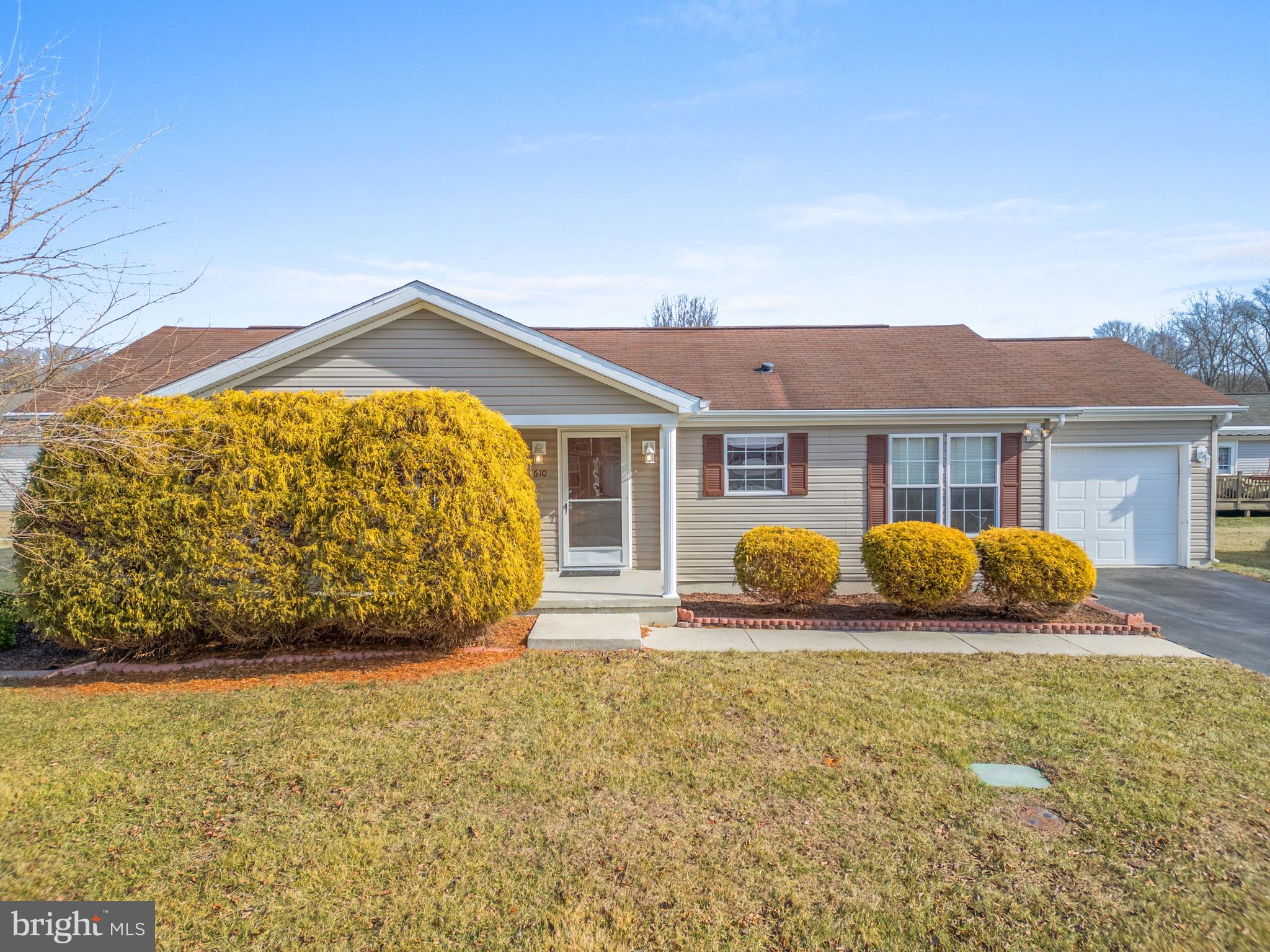 610 Audrey Drive, Unit 610 Dover, DE 19901 - Photo 2 of 27 a front view of house with yard outdoor seating and barbeque oven