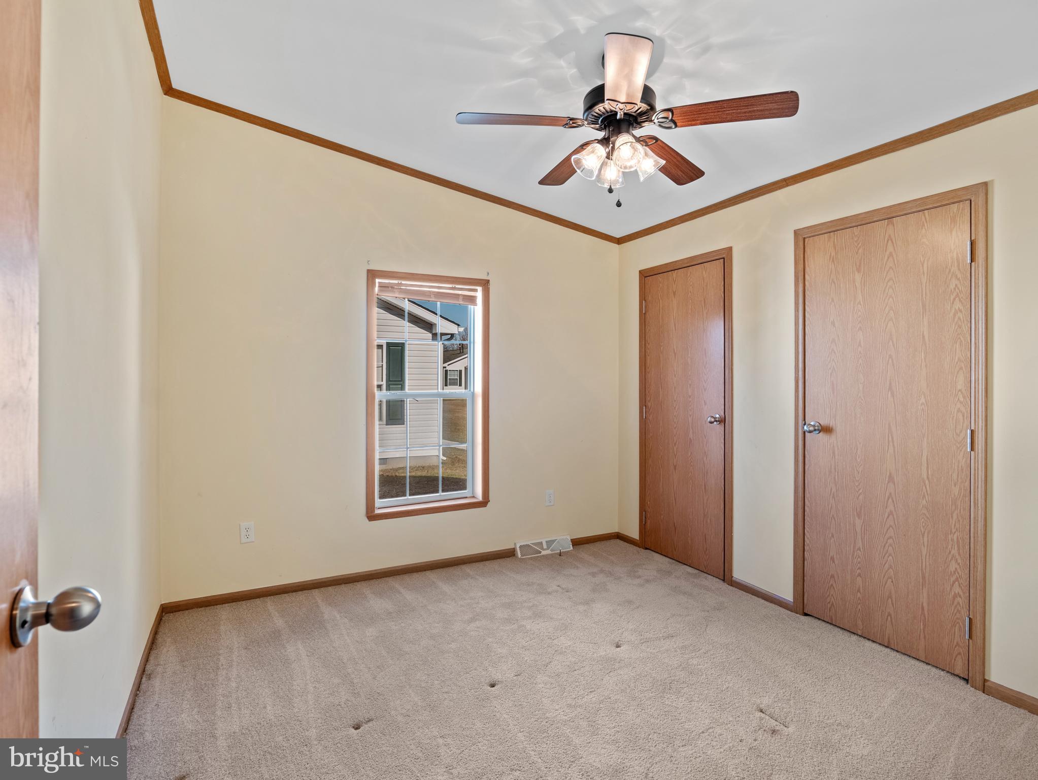 610 Audrey Drive, Unit 610 Dover, DE 19901 - Photo 21 of 27 an empty room with windows and fan
