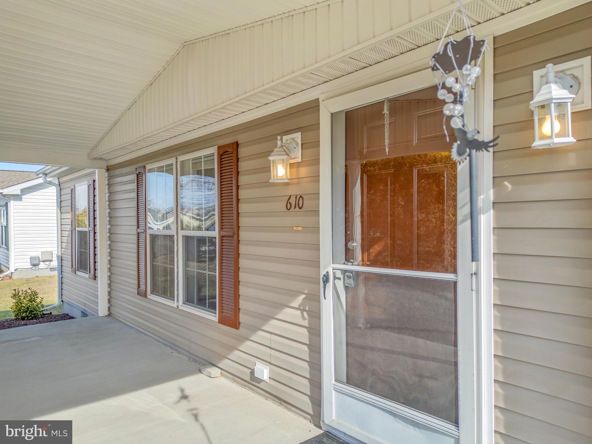 610 Audrey Drive, Unit 610 Dover, DE 19901 - Photo 3 of 27 view of porch with a black gate