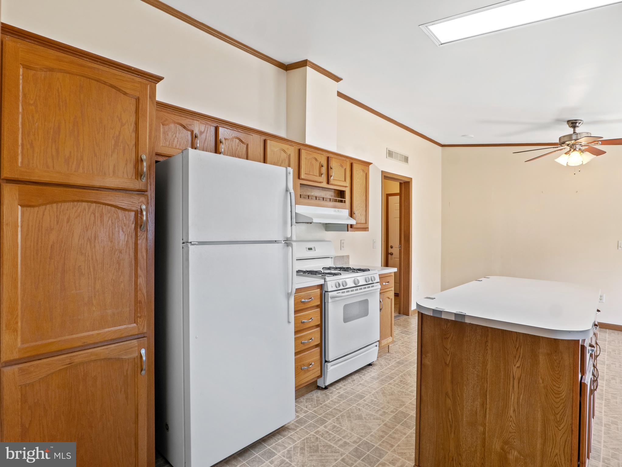 610 Audrey Drive, Unit 610 Dover, DE 19901 - Photo 10 of 27 a white refrigerator freezer and a stove in a kitchen
