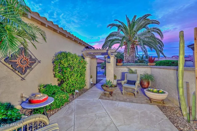 a view of a house with a small yard and plants