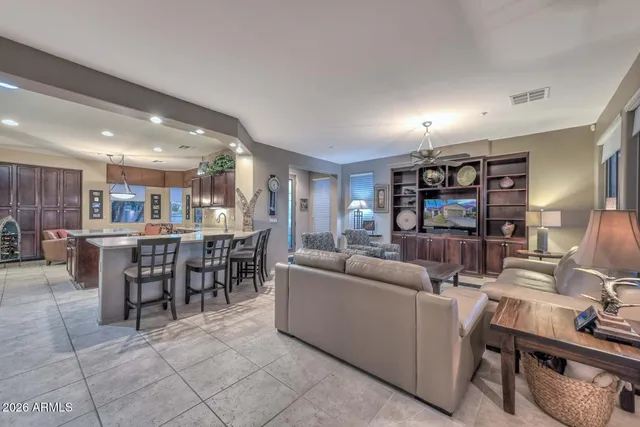 a large kitchen with a table and chairs