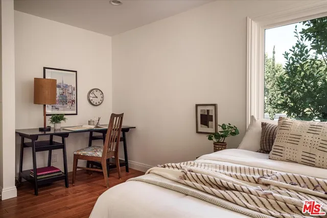 a bedroom with a bed and a table