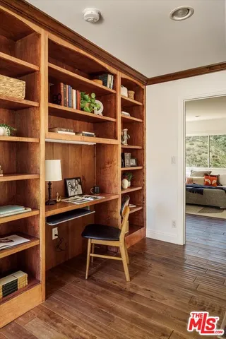 a room with furniture and a book shelf