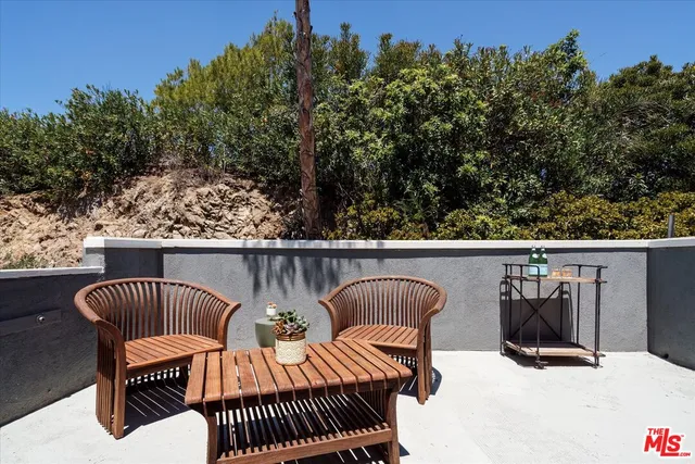 a view of roof deck with furniture