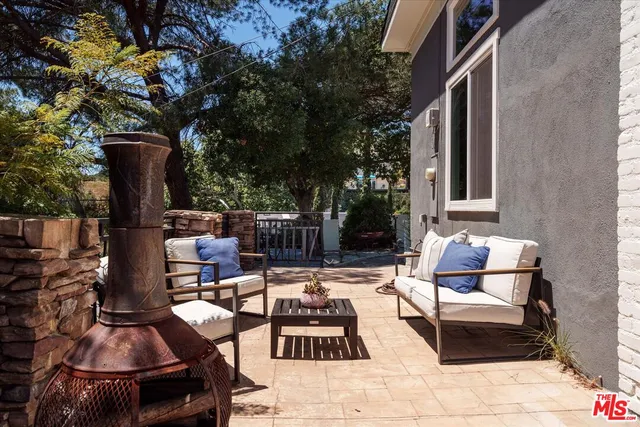 a outdoor space with patio the couches and a dining table with chairs