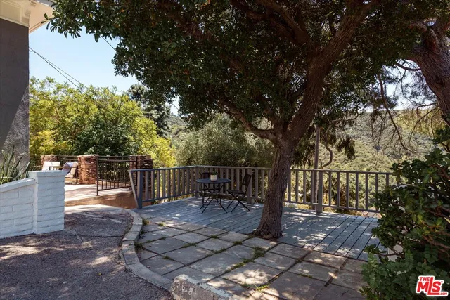 a view of a bench in the backyard